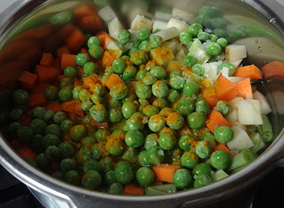 cooking vegetables for veg kurma or mixed vegetable curry