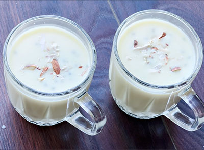 serving cold badam milk recipe or almond milkshake