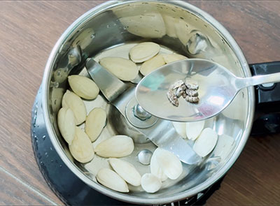 peeled almonds and cardamom for cold badam milk recipe or almond milkshake
