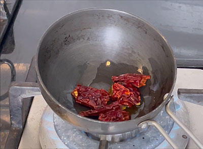 frying red chili for bellulli tambli or garlic tambuli recipe
