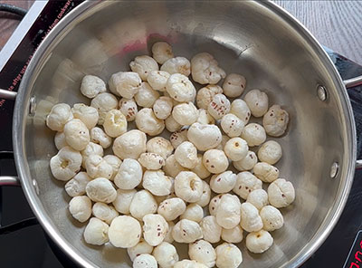 frying lotus seeds for tavare beeja payasa or makhana kheer