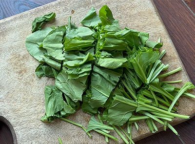 chopped palak leaves for palak soppu tambli recipe or spinach tambuli