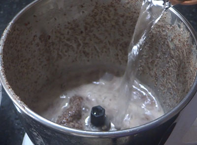 grind sesame seeds and jaggery for ragi milk or halu or milkshake or juice