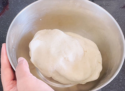 preparing dough for rava poori recipe